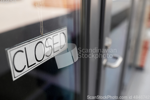 Image of close up of closed sign on office door