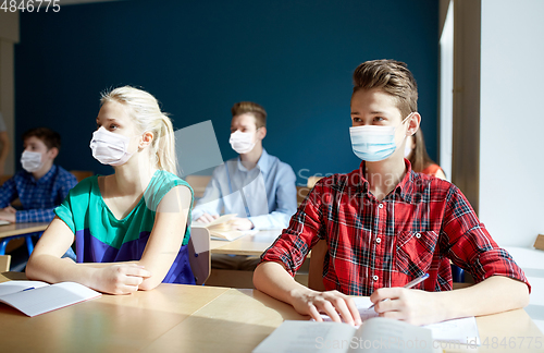 Image of group of students in masks at school lesson