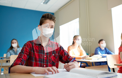 Image of group of students in masks at school lesson