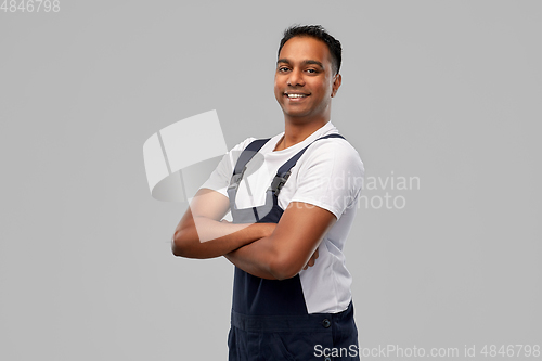 Image of happy indian worker or builder with crossed arms