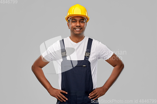 Image of happy smiling indian worker or builder in helmet