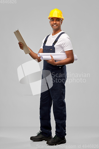 Image of happy indian builder with blueprint and clipboard