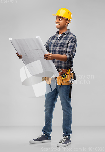Image of happy indian builder in helmet with blueprint