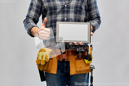 Image of male builder with tablet pc showing thumbs up