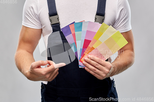 Image of close up of painter with color charts