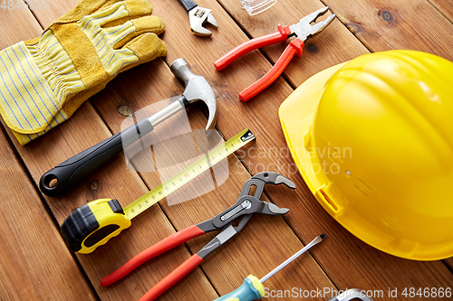 Image of different work tools on wooden boards