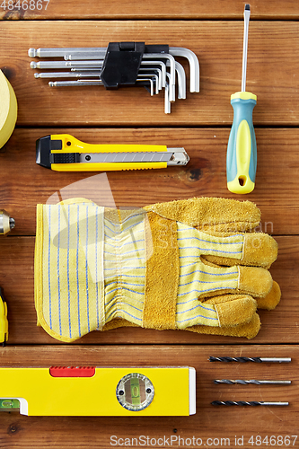 Image of different work tools on wooden boards