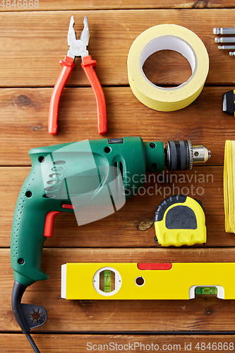 Image of different work tools on wooden boards