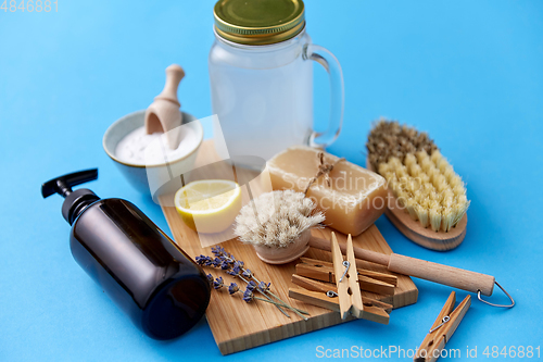 Image of washing soda, soap, brushes, lemon and clothespins