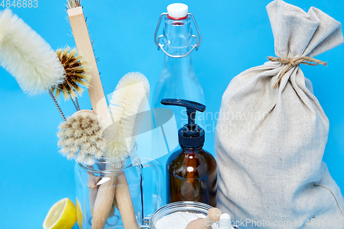 Image of lemons, soap, washing soda, vinegar and brushes