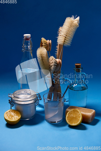 Image of lemons, soap, washing soda, vinegar and brushes