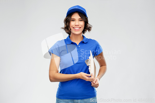 Image of happy smiling delivery girl with clipboard