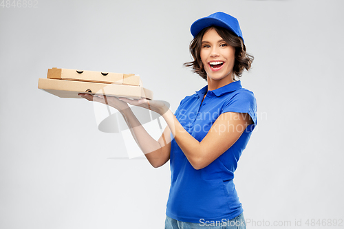 Image of delivery woman with takeaway pizza boxes