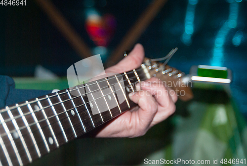 Image of playing electric guitar