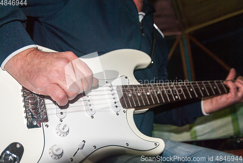 Image of playing the electric guitar