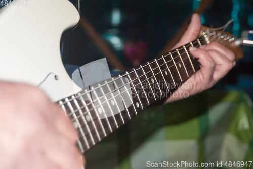 Image of playing the guitar