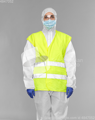 Image of healthcare or sanitation worker in hazmat suit