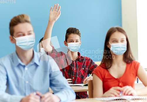 Image of group of students in masks at school lesson