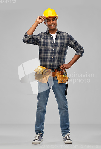 Image of happy indian builder in helmet with tool belt