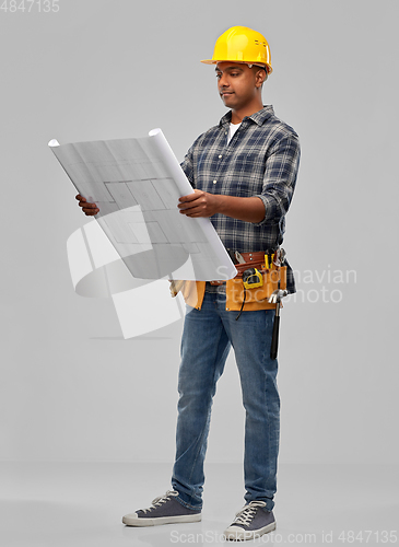 Image of indian builder in helmet with blueprint