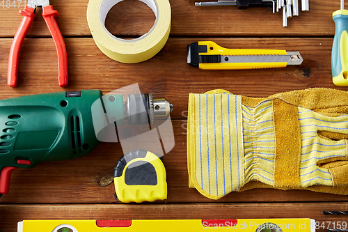 Image of different work tools on wooden boards