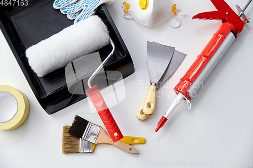 Image of different painting work tools on white background