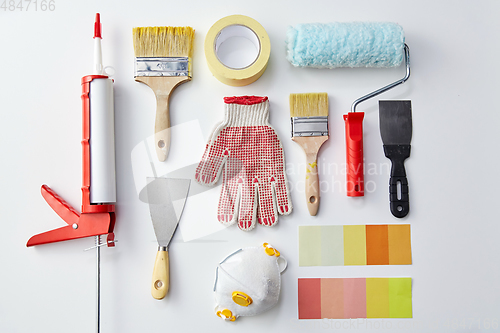 Image of different painting work tools on white background