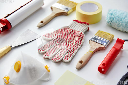Image of different painting work tools on white background