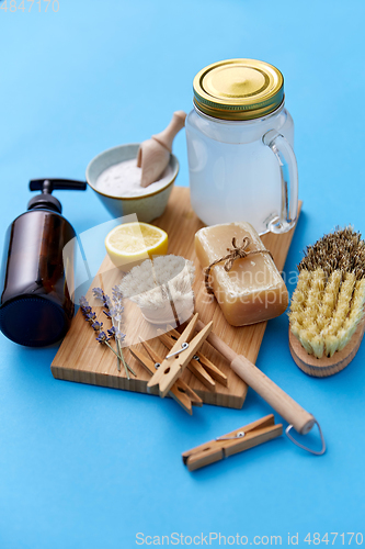 Image of washing soda, soap, brushes, lemon and clothespins