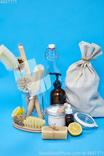 Image of lemons, soap, washing soda, vinegar and brushes