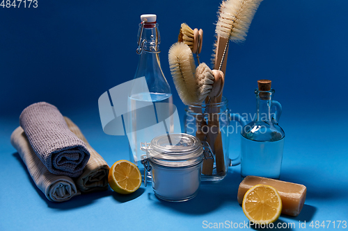 Image of lemons, soap, washing soda, vinegar and brushes