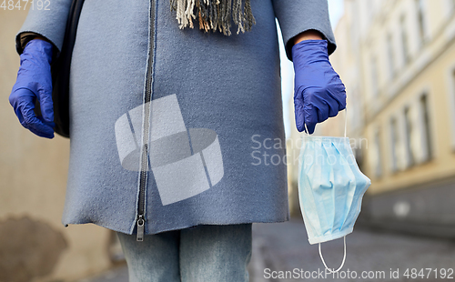 Image of young woman wearing protective medical mask