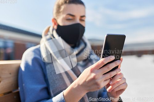 Image of woman wearing protective reusable barrier mask