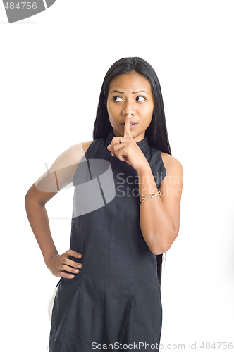 Image of young asian with finger on her lips