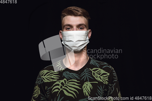 Image of Man in protective mask, coronavirus prevention, protection concept