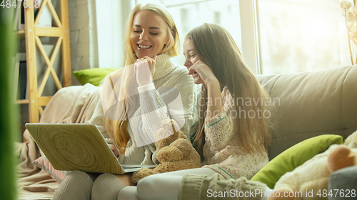 Image of Happy loving family, mother and daughter spending time together at home
