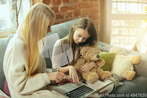 Image of Happy loving family, mother and daughter spending time together at home