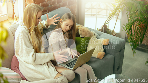 Image of Happy loving family, mother and daughter spending time together at home