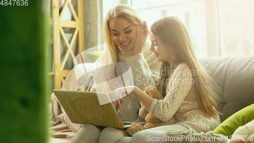 Image of Happy loving family, mother and daughter spending time together at home