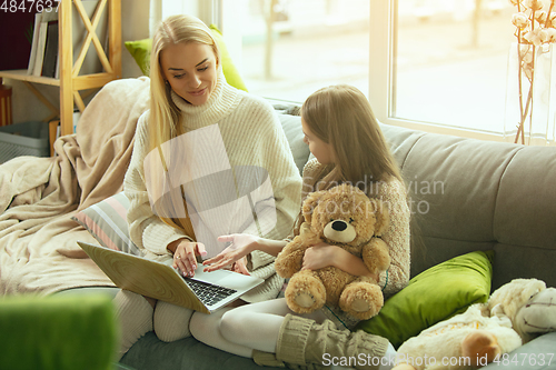 Image of Happy loving family, mother and daughter spending time together at home