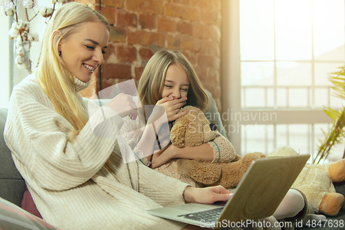 Image of Happy loving family, mother and daughter spending time together at home