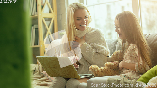 Image of Happy loving family, mother and daughter spending time together at home