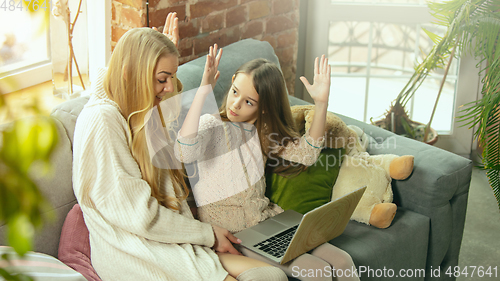 Image of Happy loving family, mother and daughter spending time together at home