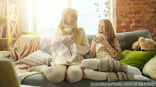 Image of Happy loving family, mother and daughter spending time together at home