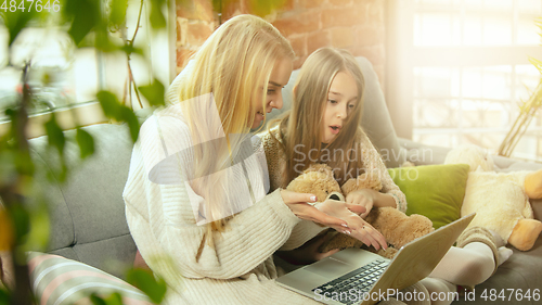 Image of Happy loving family, mother and daughter spending time together at home
