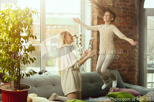 Image of Happy loving family, mother and daughter spending time together at home