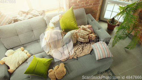 Image of Happy loving family, mother and daughter spending time together at home