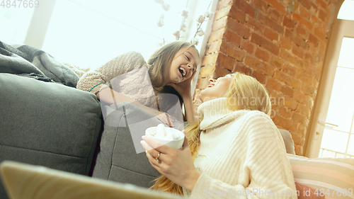 Image of Happy loving family, mother and daughter spending time together at home