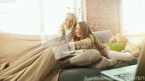 Image of Happy loving family, mother and daughter spending time together at home