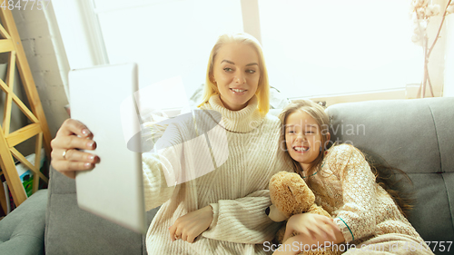 Image of Happy loving family, mother and daughter spending time together at home